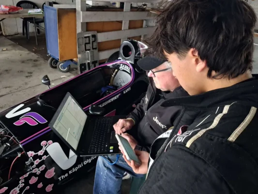 yoshi-comeskey-analysing-telemetry-dennis-martin-sabre-motorsport